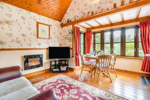 a living room with a table and a tv at 2 Bed in Devils Bridge oc-d29575 in Devils Bridge
