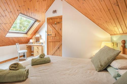 a bedroom with a large bed with a skylight at 2 Bed in Devils Bridge oc-d29575 in Devils Bridge