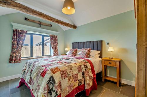 a bedroom with a bed and a window at 1 Bed in Saltfleetby oc-b30073 in Saltfleetby Saint Peter