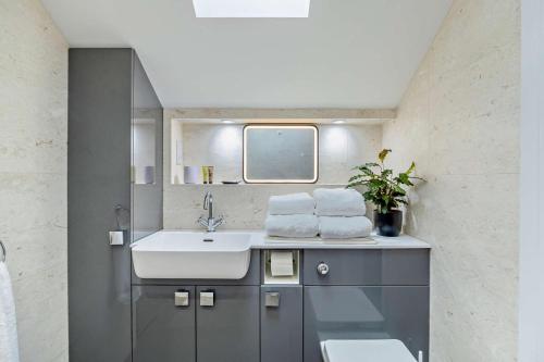 a bathroom with a sink and a mirror at 1 Bed in Saltfleetby oc-b30073 in Saltfleetby Saint Peter