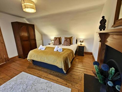 a bedroom with a bed with two towels on it at 3 Bed in Aviemore oc-s30815 in Aviemore