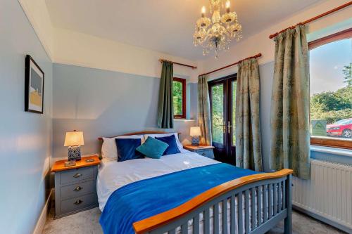 a bedroom with a bed and a window at 5 Bed in Dymchurch oc-w30161 in Dymchurch