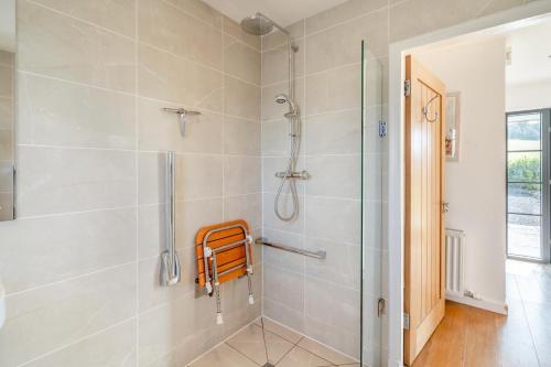 a bathroom with a shower and a glass shower stall at 3 Bed in Newburgh oc-h32592 in Newburgh