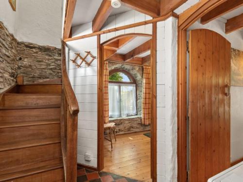 a hallway with a wooden door and a window at 2 Bed in Hebron oc-y30098 in Whitland