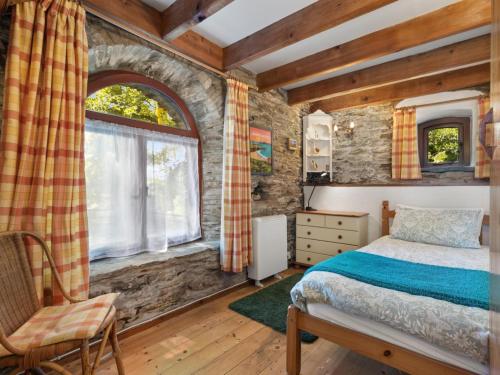 a bedroom with a bed and a window at 2 Bed in Hebron oc-y30098 in Whitland