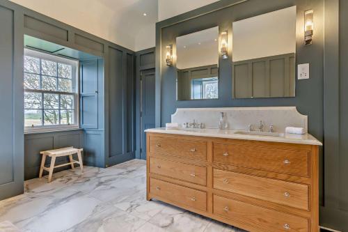 a bathroom with a sink and a large mirror at 3 Bed in Scarfskerry oc-o30016 in Scarfskerry