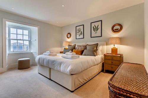a bedroom with a large white bed and a window at 3 Bed in Scarfskerry oc-o30016 in Scarfskerry
