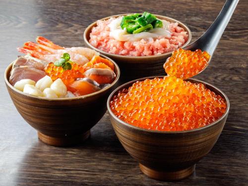 three bowls filled with different types of food on a table at Solaria Nishitetsu Hotel Sapporo in Sapporo