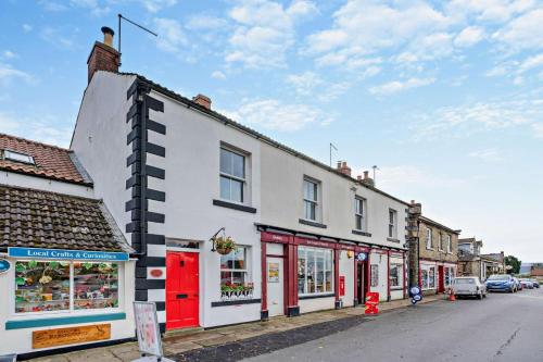 a row of buildings on a city street at 3 Bed in Goathland oc-p30205 in Goathland