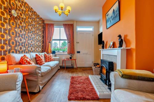 a living room with a couch and a fireplace at 3 Bed in Goathland oc-p30205 in Goathland