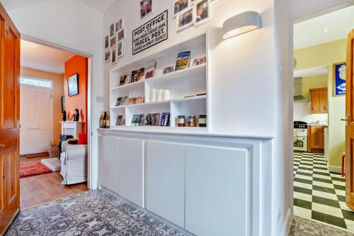 a living room with a white wall with shelves at 3 Bed in Goathland oc-p30205 in Goathland