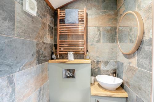 a bathroom with a sink and a mirror at 1 Bed in Brecon oc-t31948 in Bronllys