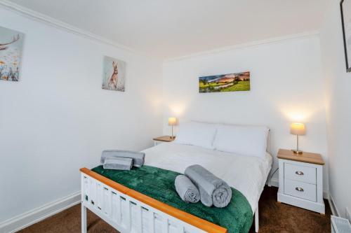 a bedroom with a bed with towels on it at 2 Bed in Rothbury oc-e31872 in Rothbury