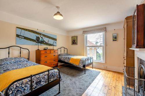 a bedroom with two beds and a fireplace at 5 Bed in Battle oc-c31779 in Battle