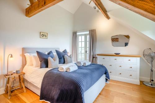 a bedroom with a bed with towels on it at 6 Bed in Llanwern oc-w31947 in Brecon