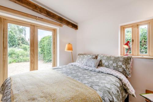 a bedroom with a bed and a window at 1 Bed in Luddenham oc-s32602 in Luddenham
