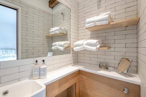 a white bathroom with a sink and a mirror at 1 Bed in Luddenham oc-s32602 in Luddenham