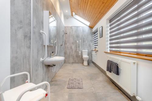 a bathroom with a sink and a toilet at 5 Bed in Devils Bridge oc-t13712 in Devils Bridge
