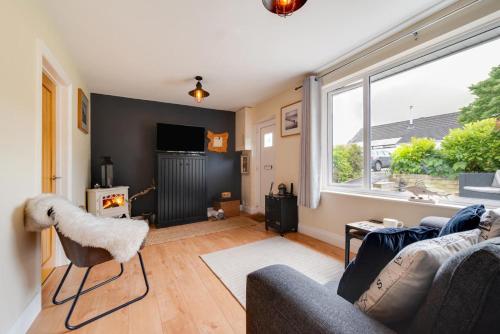 a living room with a couch and a window at 2 Bed in Mumbles oc-hh993 in The Mumbles