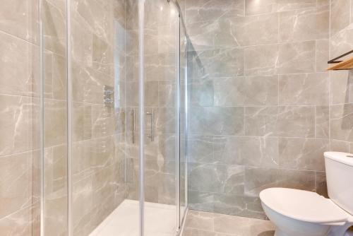 a bathroom with a shower and a toilet at 5 Bed in Briston oc-2304 in Briston