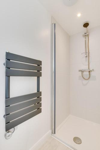 a shower in a bathroom with a glass door at 1 Bed in Saltdean oc-bbidre in Saltdean