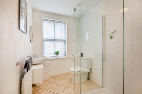 a bathroom with a toilet and a sink and a shower at 2 Bed in Aspatria oc-p32645 in Aspatria