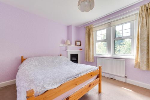 a bedroom with a bed and a window at 3 Bed in Littlestone oc-bt009 in New Romney