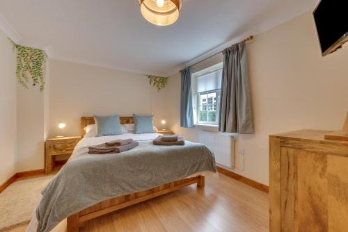 a bedroom with a large bed and a window at 1 Bed in Rhodes Minnis oc-ct041 in Lyminge