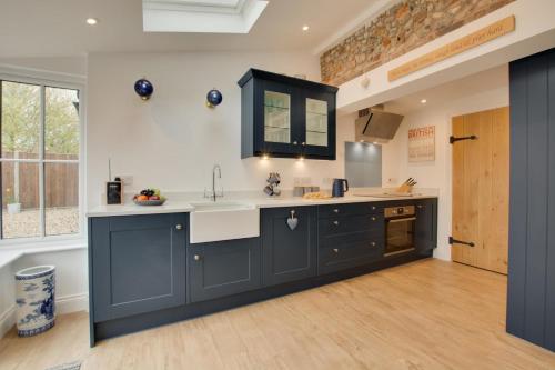 a kitchen with a sink and a counter top at 2 Bed in Holt oc-2148 in Holt