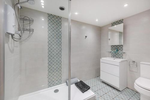 a bathroom with a shower and a toilet and a sink at 1 Bed in Yapton oc-b32757 in Yapton