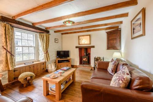 a living room with a couch and a table at 2 Bed in St Davids oc-30269 in St. Davids