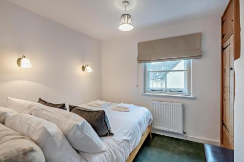 a bedroom with two beds and a window at 2 Bed in Lavenham oc-f30054 in Lavenham