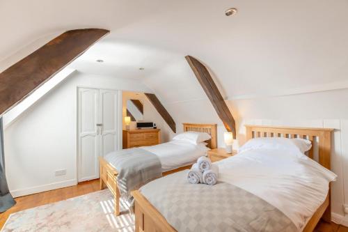 two beds in a room with an attic at 3 Bed in Wooler oc-m31820 in Wooler