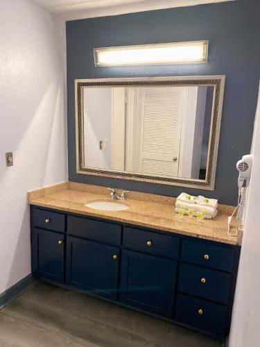 a bathroom with a sink and a mirror at Extended Stay of Charleston in Charleston