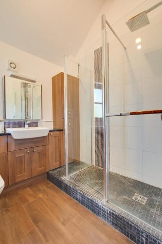 a bathroom with a shower and a sink at 2 Bed in Roughton oc-1734 in Roughton