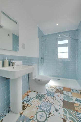 a bathroom with a sink and a toilet at 5 Bed in Mundesley oc-2189 in Mundesley