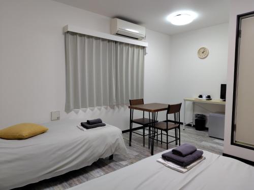 Posteľ alebo postele v izbe v ubytovaní Hotel Chuo Oasis