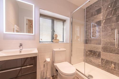 a bathroom with a toilet and a sink and a shower at 2 Bed in Windermere oc-gl064 in Windermere