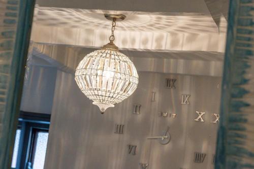 a chandelier hanging from a ceiling in a room at 2 Bed in Whitby oc-r563 in Robin Hood's Bay