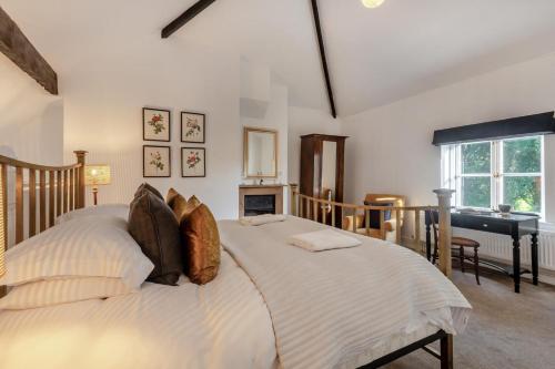 a bedroom with a large bed and a piano at 3 Bed in Bessingham oc-b28837 in Thurgarton