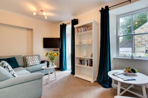 a living room with a couch and a table at 2 Bed in St. Levan oc-p00851 in Saint Levan
