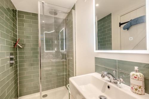a bathroom with a sink and a shower at 2 Bed in Holt oc-2027 in Thornage