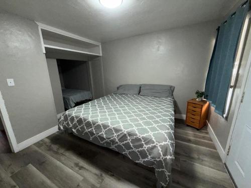 a small bedroom with a bed and a window at Downtown Apt 5 Min Walk to Downtown - Free Parking in Las Vegas