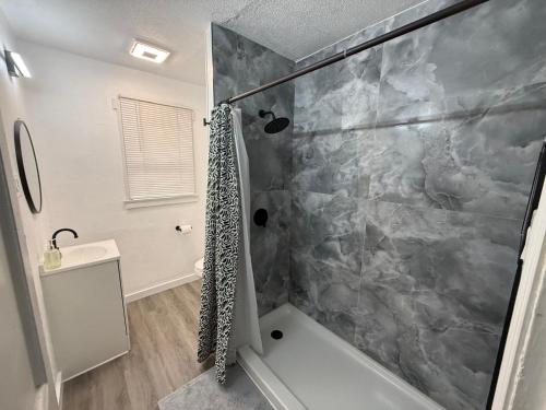 a bathroom with a shower and a sink at Downtown Apt 5 Min Walk to Downtown - Free Parking in Las Vegas