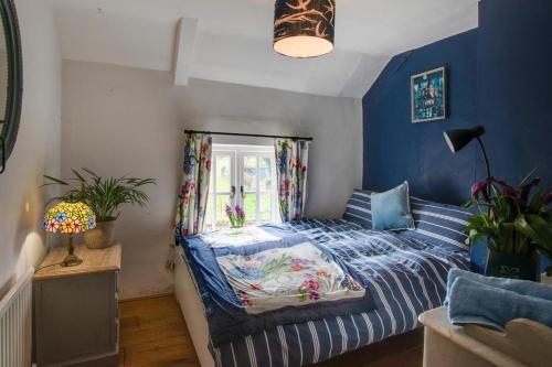 a bedroom with a bed and a window at 5 Bed in Hindolveston oc-d29357 in Hindolveston
