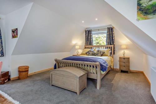 a bedroom with a bed and a window at 1 Bed in Strathpeffer oc-h30077 in Strathpeffer