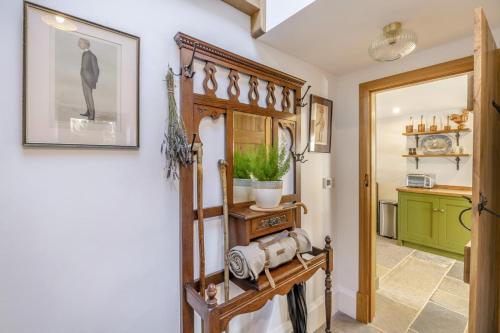 a hallway with a wooden cabinet and a green kitchen at 2 Bed in Cowling oc-l30774 in Cowling