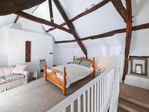 a white bedroom with a bed and a staircase at 1 Bed in Corbridge oc-t31977 in Corbridge