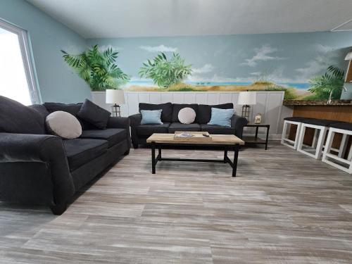 a living room with a couch and a coffee table at Seaside Gem in Biloxi