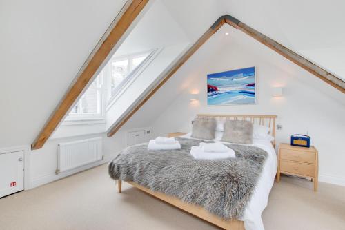 a bedroom with a large bed in a attic at 2 Bed in Fowey oc-forty in Fowey